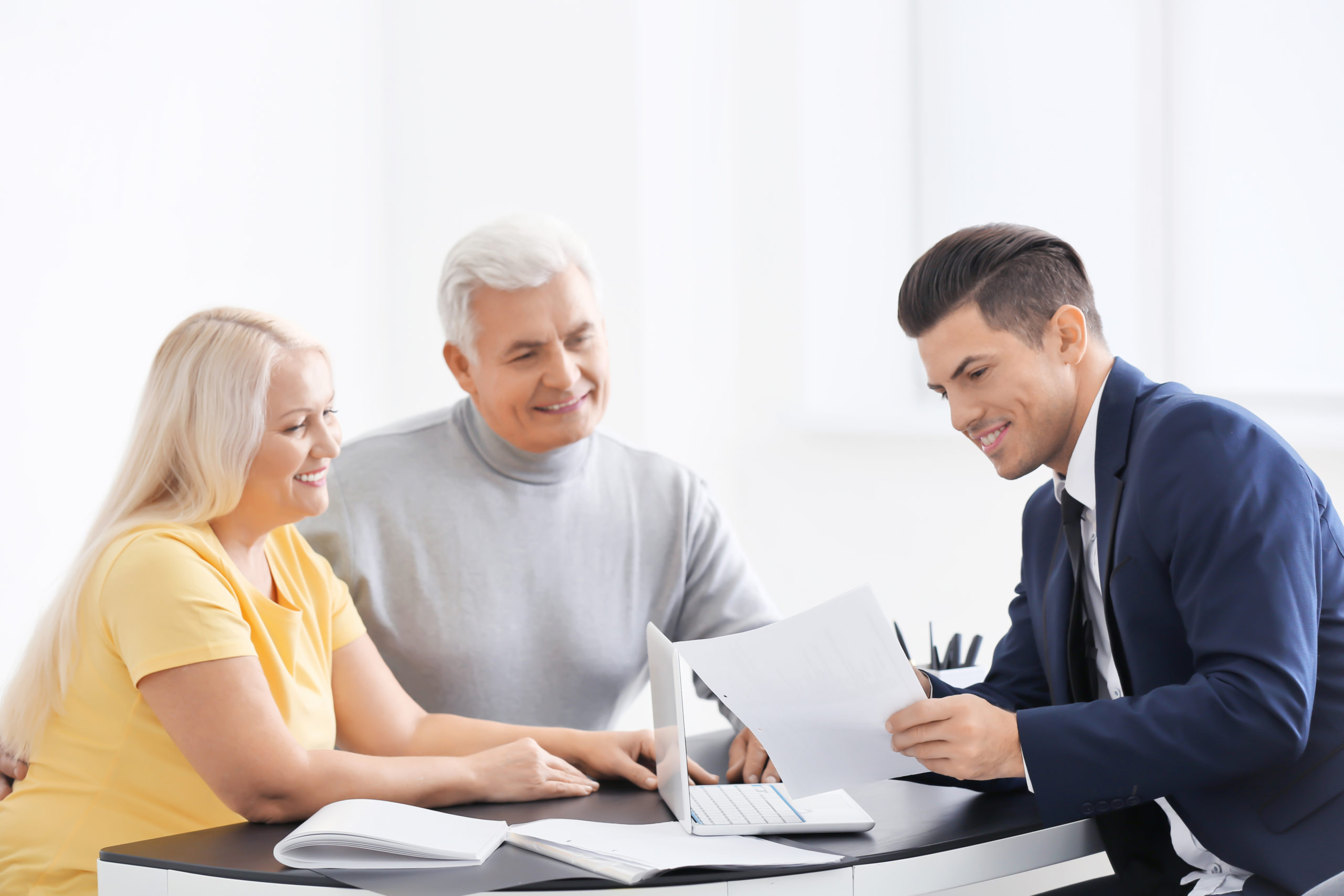 Senior couple meeting with consultant in office